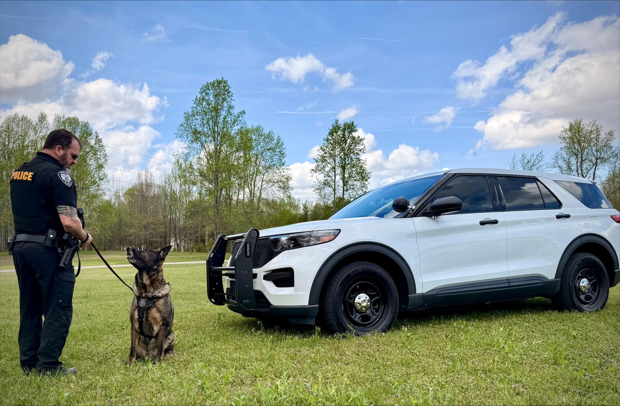 Photo of OPD officer with K9